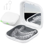 Clear dental retainers in a white case with a mirror on a white background